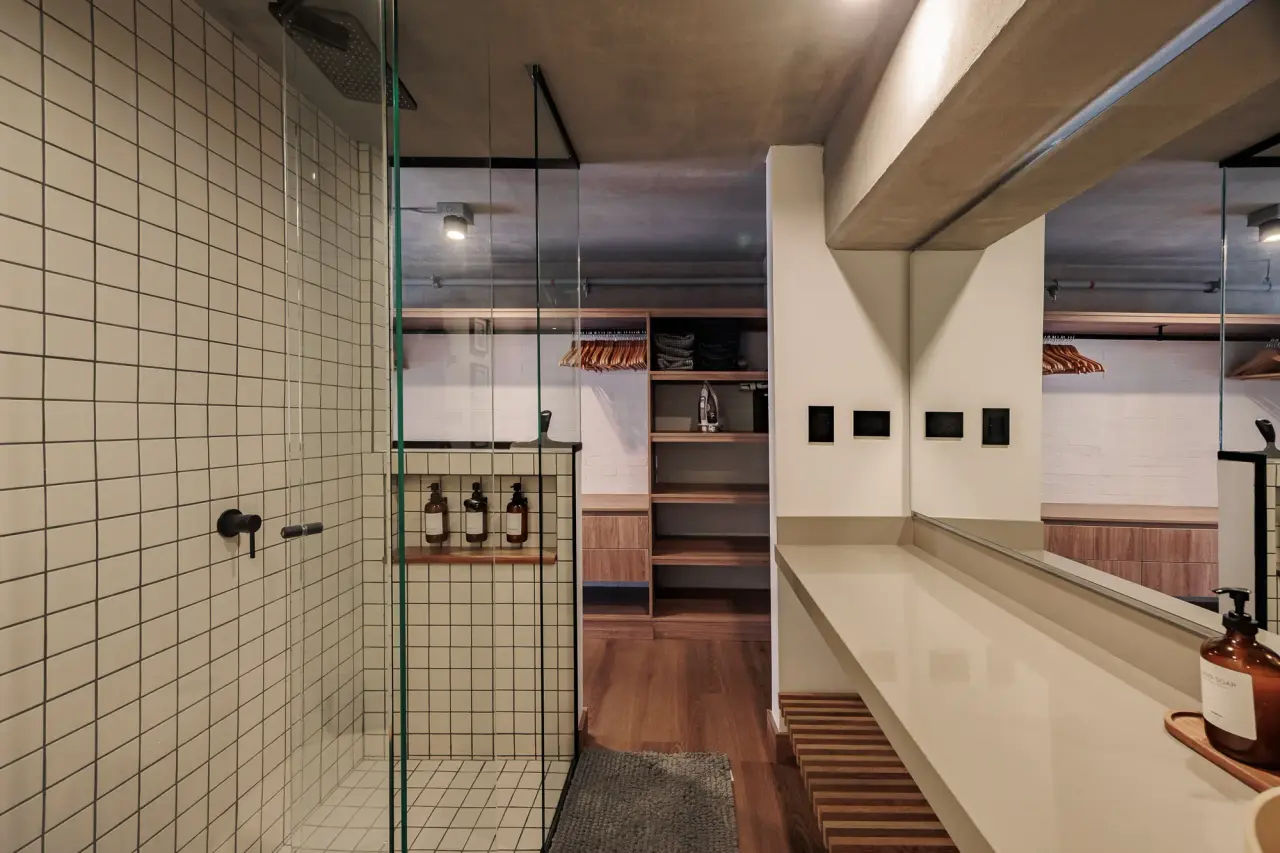 Tiled shower behind a glass screen at Downtown Loft