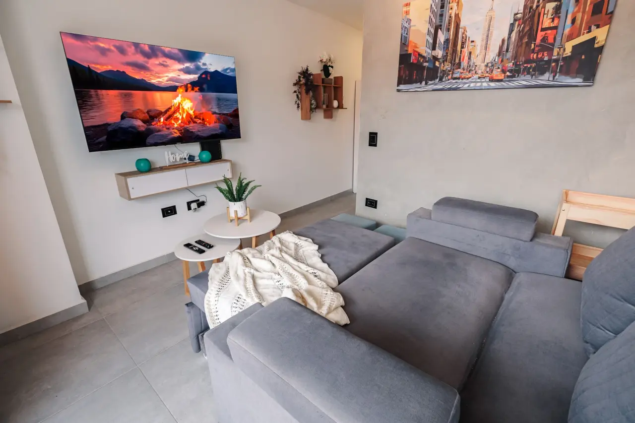 Sectional sofa facing the wall TV in the living room