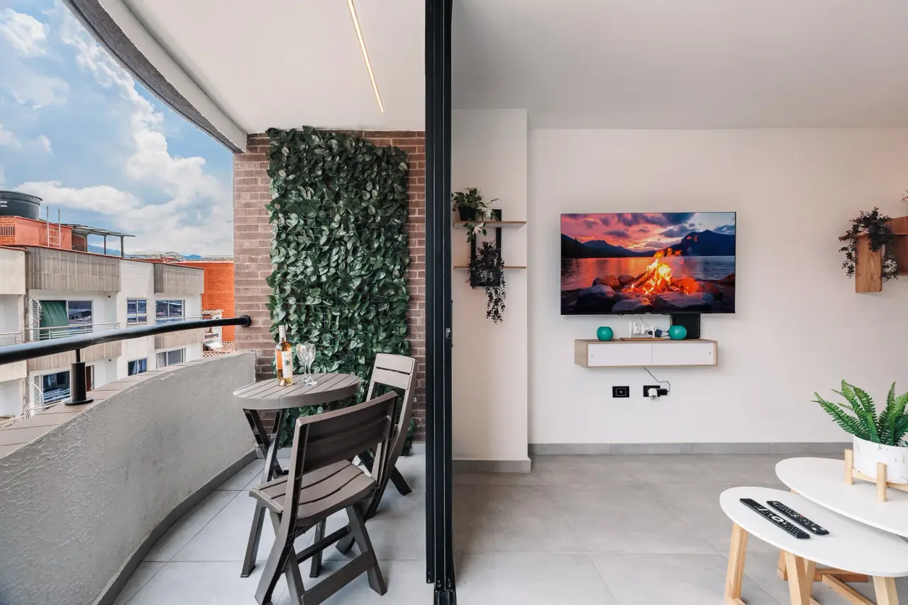 The balcony's green wall and table beside the living room