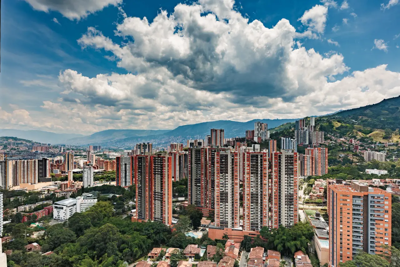 The south of the Aburrá Valley from the 30th floor: Sabaneta's towers and the mountains behind